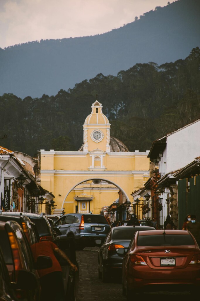 Best Places to Go in Antigua: The iconic Santa Catalina Arch with the Agua Volcano in the background.