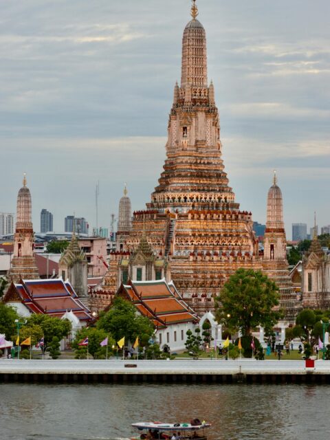 Bangkok Travel Attractions: Wat Arun, an iconic riverside temple with intricate architecture.