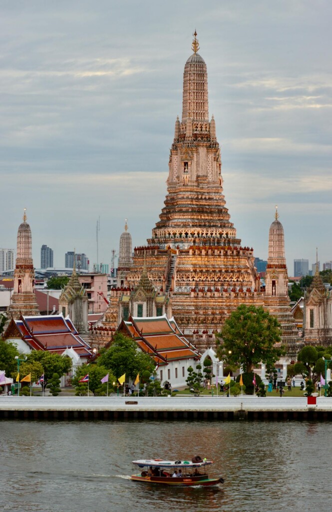 Bangkok Travel Attractions: Wat Arun, an iconic riverside temple with intricate architecture.