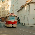 Best Things to Do in Prague, Czech Republic: A striking red tram on the streets of Prague, a unique and iconic mode of transport.