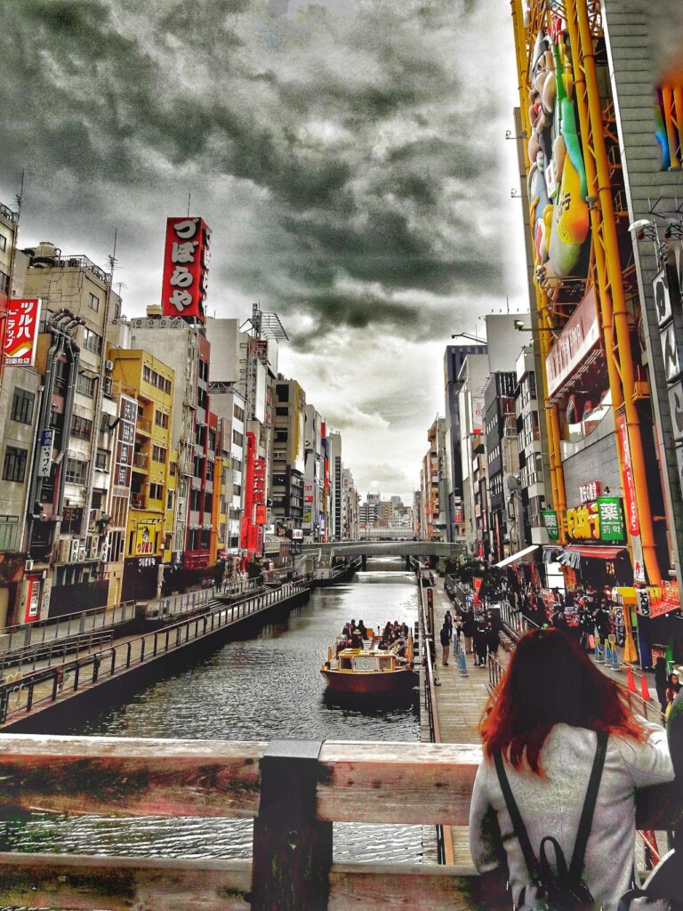 Osaka best things to do: Evening cruise along the Dotomborigawa River with city views.