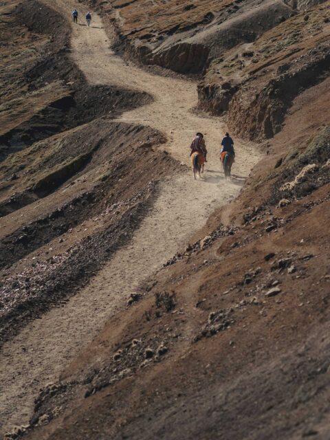 Peru Travel Itinerary 10 Days: Hiking through the colorful landscape of Rainbow Mountain in Peru.