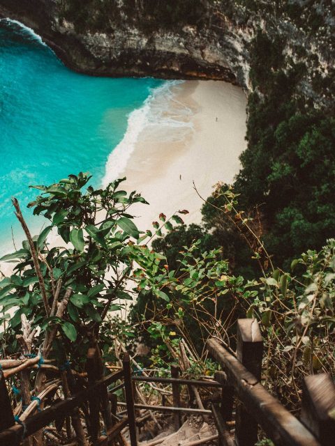 Indonesia travel advice: Aerial view of T-Rex Bay with its iconic cliff resembling a dinosaur