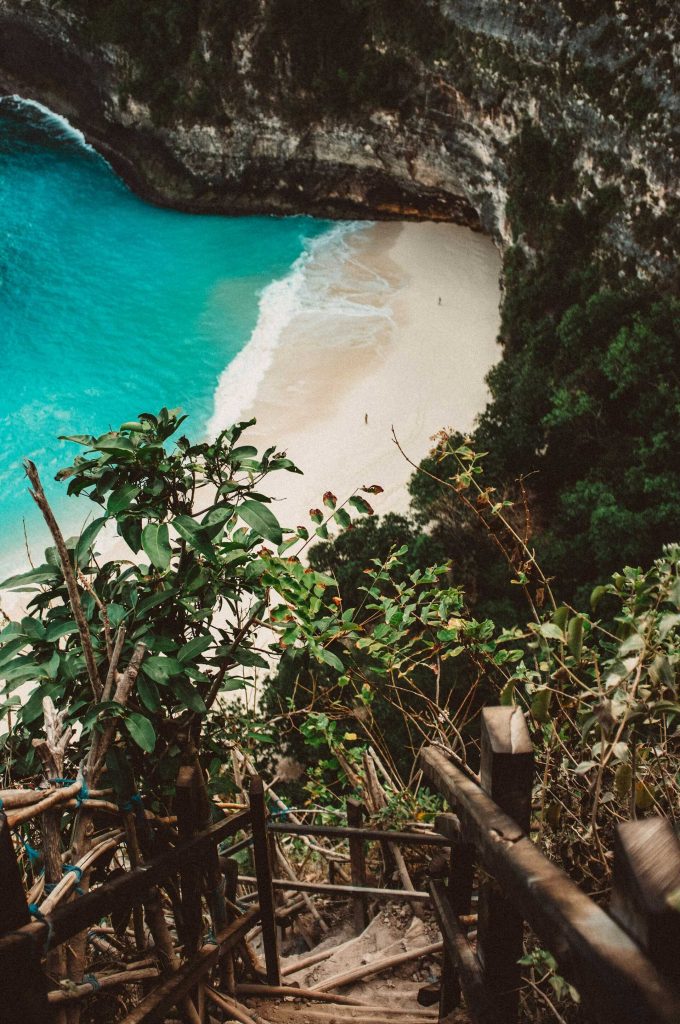 Indonesia travel advice: Aerial view of T-Rex Bay with its iconic cliff resembling a dinosaur